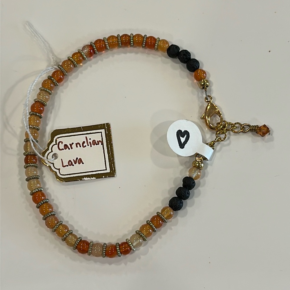 Homemade artisan bracelet made with authentic carnelian gemstones and lava beads